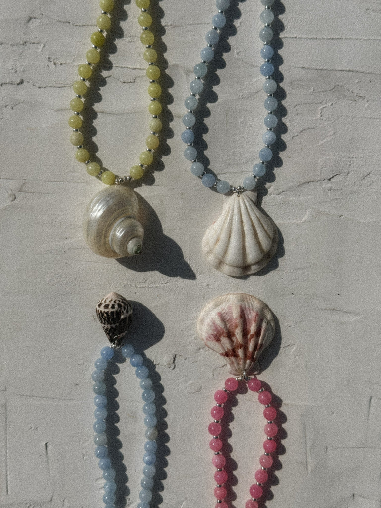 Natural shell necklaces in blue, pink, white and lime with jade beads and sterling silver, handmade in Salcombe, Devon by Alula Collections Jewellery.