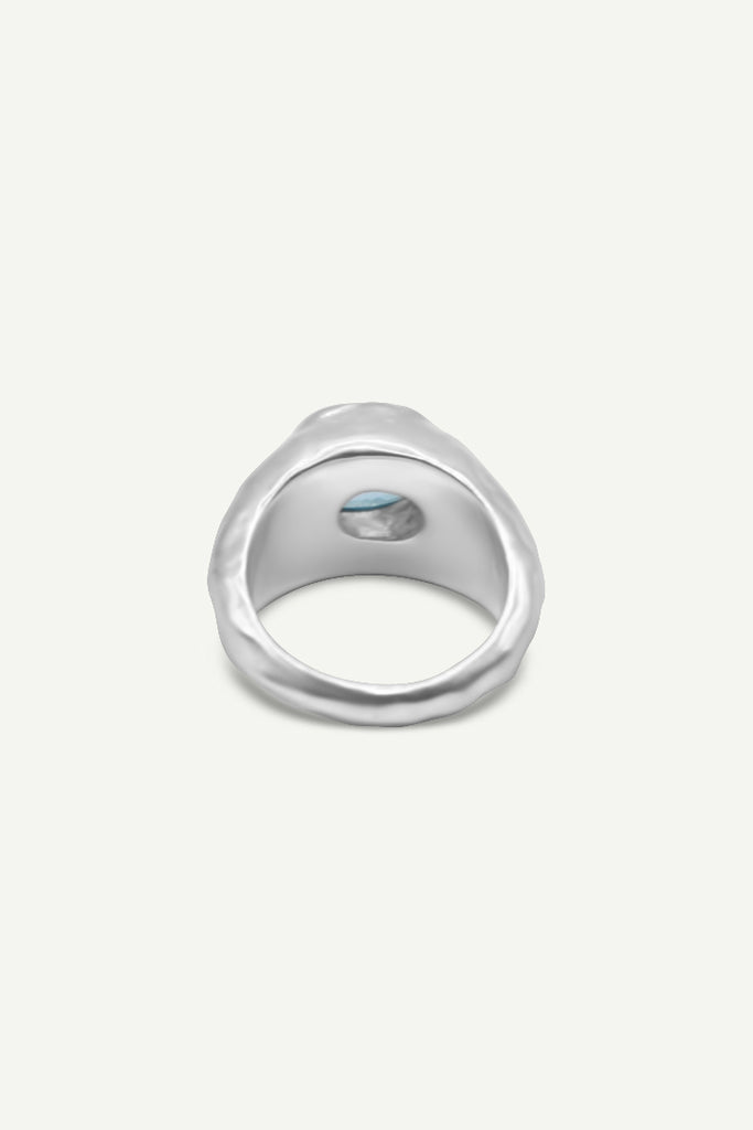 Close-up of Alula Luxe Swiss Blue Topaz ring with textured silver band Back by Alula Collections