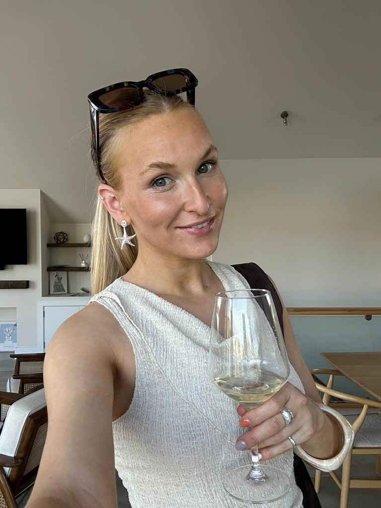 Ellea Lowe, founder of Alula Collections Wearing Alula Luxe Starfish Earrings. 925 sterling silver statement earrings, originating in Salcombe, Devon by Alula Collections Jewellery. est.2016