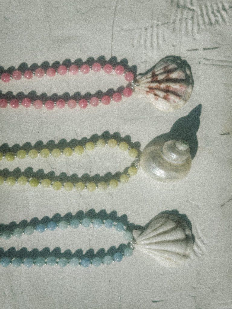Natural shell necklace in pink, yellow and blue, with jade beads and sterling silver, handmade in Salcombe, Devon by Alula Collections Jewellery.