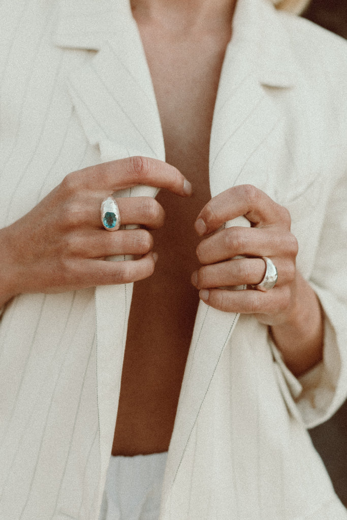Alula Luxe handcrafted sterling silver ring featuring ocean-blue Swiss Blue Topaz.
