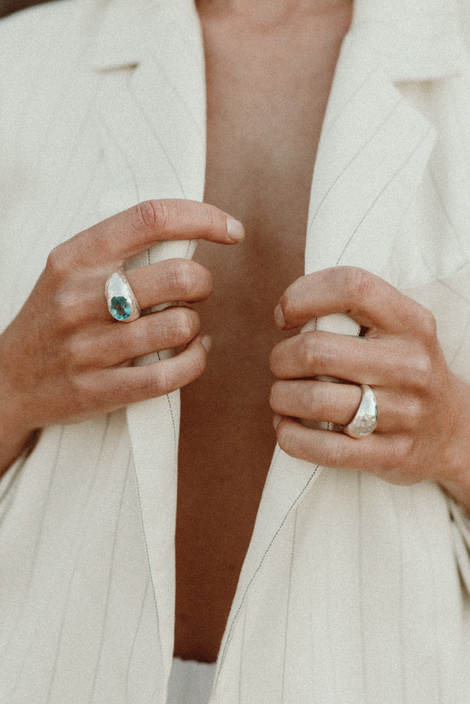 Alula sterling silver dome ring stacked with blue topaz ring by Alula Collections